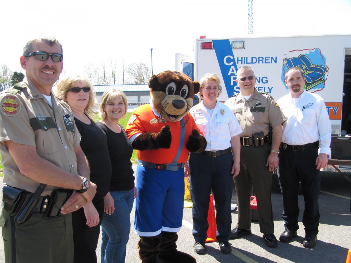 Ollie Otter with state troopers